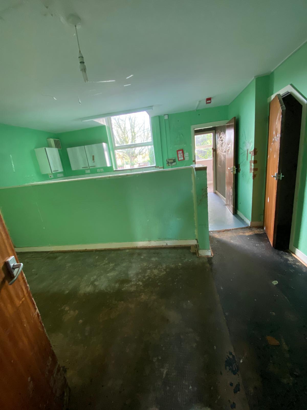 Former HMO kitchen and dining area before refurbishment